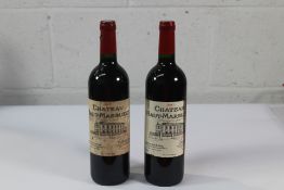 Two Chateau Haut - Marbuzet 2017 Red Wines 2 x 750ml Labels Distressed.