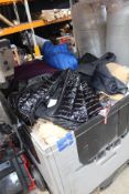 One Stillage of Assorted As New and Used Clothing (Stillage Not Included).