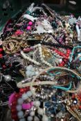 A Crate of Assorted Pre-owned/As New Costume Jewellery To Include Necklaces, Earrings, Bangles/Brace
