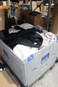 One Stillage of Assorted As New and Used Clothing (Stillage Not Included).