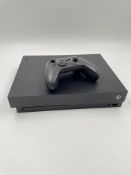 Pre-owned Microsoft Xbox One X (M/N: 1787) with controller.