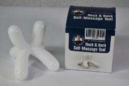 A Dr. Berg's Amazing Neck and Back Self-Massage Tool.