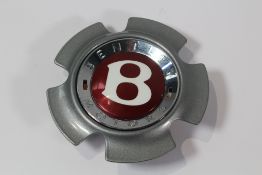 A 2004 2012 Bentley Continental GT GTS W12 part CENTER CAP (3W0601165BA). Pre-owned (Clip Missing).