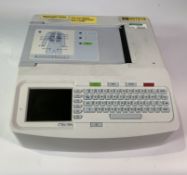 A Mortara Eli 150c Series 2 Electrocardiograph with no cables. Pre-owned. (Some damage on bottom cor