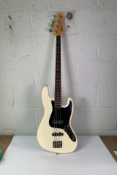 Vintage V49 Coaster 4 String Bass Guitar, Vintage White. Pre-owned, crack by neck, chip on the back