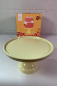 Six Little Lovely Company Cake Stands, Yellow, Size 23.5cm x 23.5 x 12cm. As New.