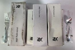 WMF assortment of cutlery; sixty seven teaspoons and seven dessert forks. Box worn. Items As New.