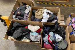 Four boxes of hats/caps.