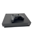 Pre-owned Microsoft Xbox One X (M/N: 1787) with controller.