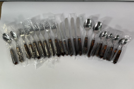 Twenty four pieces of Rebecca Udall Classic Cutlery 'Tortoiseshell': Five Knives, Seven Forks, Four