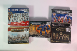 Five various Warhammer Series to include 40,000, Blood Bowl, Legions Imperialis, Age of Sigmar. Seal