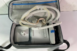 A Philips Respironics DreamStation Auto cpap with accessories (SN J25410097246E).