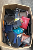 A box of assorted purses and wallets.