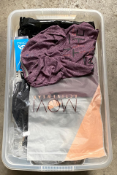 A box of clothing (25 items).