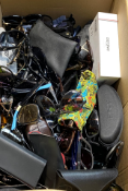 A box of assorted sunglasses and other glasses.