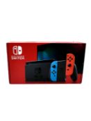 Pre-owned Nintendo Switch OLED Console (Damaged USB-C port) with Joy-Cons, Comfort Grip, Dock, Mario