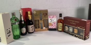 Eight assorted wines and spirits to include Roku Japanese Craft Gin, Tanqueray No Ten, Berlucchi 61