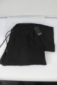 A pair of men's Benklark Off Court Pleated Pants - Black (L).A pair of men's Benklark Off Court Pl