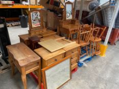 A mixed lot of pre-owned pine furniture to include cabinets, dressing table, mirrors and chairs, etc