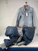 Sixteen Pairs of Nudie Denim Jeans and One Denim Jacket in various sizes and styles - All Pre-Owned
