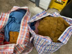 Two large bags of men's and women's assorted pre-owned clothing.