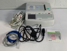 A Mortara Eli 150c Resting Electrocardiograph (ECG) with some cables. Item is Pre-owned.