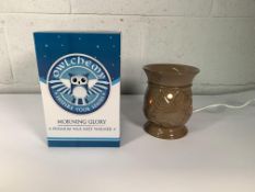 A pallet of Owlchemy Morning Glory Premium Wax Melt Warmers. As New (approximately 300).