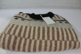 A 'The Knotty One' Alpaco wool jumper in off white knitted by Daiva (Size 8).