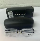 A pair of Oakley Sway Bar 0.5 Matte Midnight Demo Lens Glasses in case and box (00X5076).