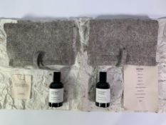 Two bottles of Perfumer H - eau de parfum - Rain Wood 50ml and Charcoal 50ml contained in a material