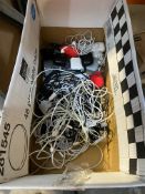 A box containing headphones and cables.