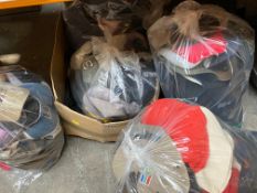 A box and five bags of pre-owned hats and caps.