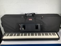 Pre-owned Roland FP-10 Digital Piano with Power Supply and Pedal in a Gator Travel Case.