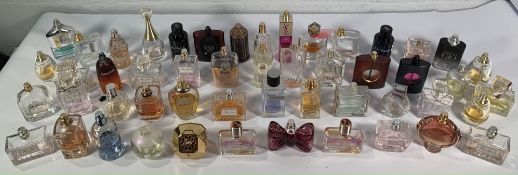 Approximately forty assorted half used or less perfume/eau de toilette to include Black Opium, Giorg