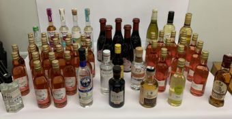 Fifty five assorted small, half bottles of Wine and Spirits.