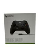 As new Xbox Wireless Controller with USB-C Cable in Carbon Black (EAN: 889842657517) (Box sealed).