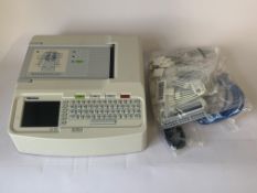 A Mortara Eli 150c Resting Electrocardiograph (ECG) with some cables. Item is Pre-owned.