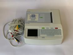 Pre-owned Mortara Eli 150c Resting Electrocardiograph (ECG) with some cables.