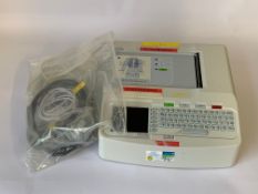 Pre-owned Mortara Eli 150c Resting Electrocardiograph (ECG) with some cables.
