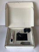 An Aesculap Durati Cordless Clipper ProWhite with a Battery Charger and Two Batteries. Clipper Blade