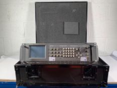 Pre-owned Tektronix TG2000 Signal Generation Platform in a hard case. Has some damage to front fasci