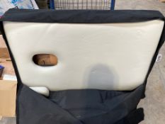 A massage table (Pre-owned with some marks).