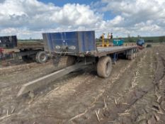 Tri-axle 45ft flat bed bale trailer with air brakes on 385/65R22.5 wheels and tyres with dolly