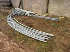 Twin span poly tunnel frame with central guttering channel and irrigation pipework. Each tunnel span