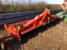 Kuhn HR4001 power harrow with rear packer and bolt on tines, PTO driven, linkage mounted.