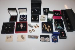 A box containing a large quantity of ear-rings and