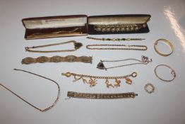 A rolled gold bangle; various gold tone jewellery