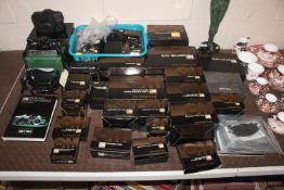 A collection of various Olympus cameras and camera