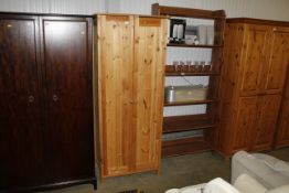 A modern pine hanging wardrobe