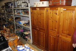 A modern pine two door wardrobe